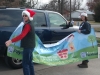 LBFOL volunteers hang our banner in the parking lot